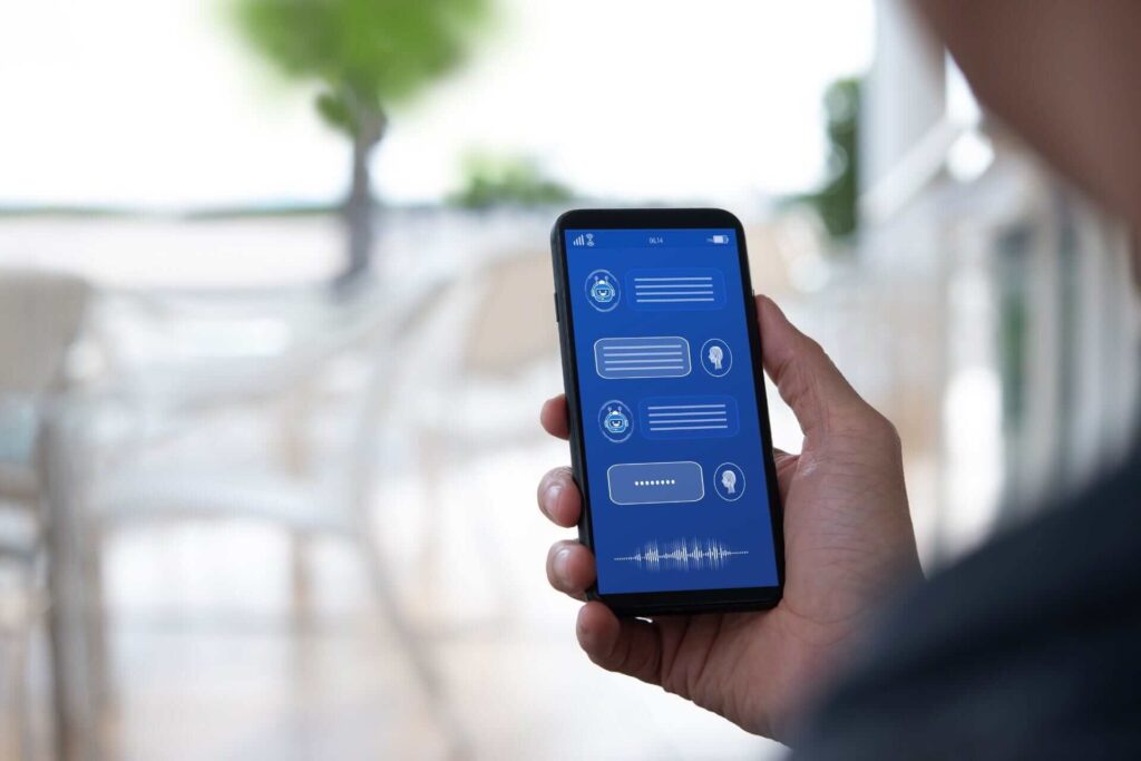 A man holding a smartphone with an AI chatbot assistant