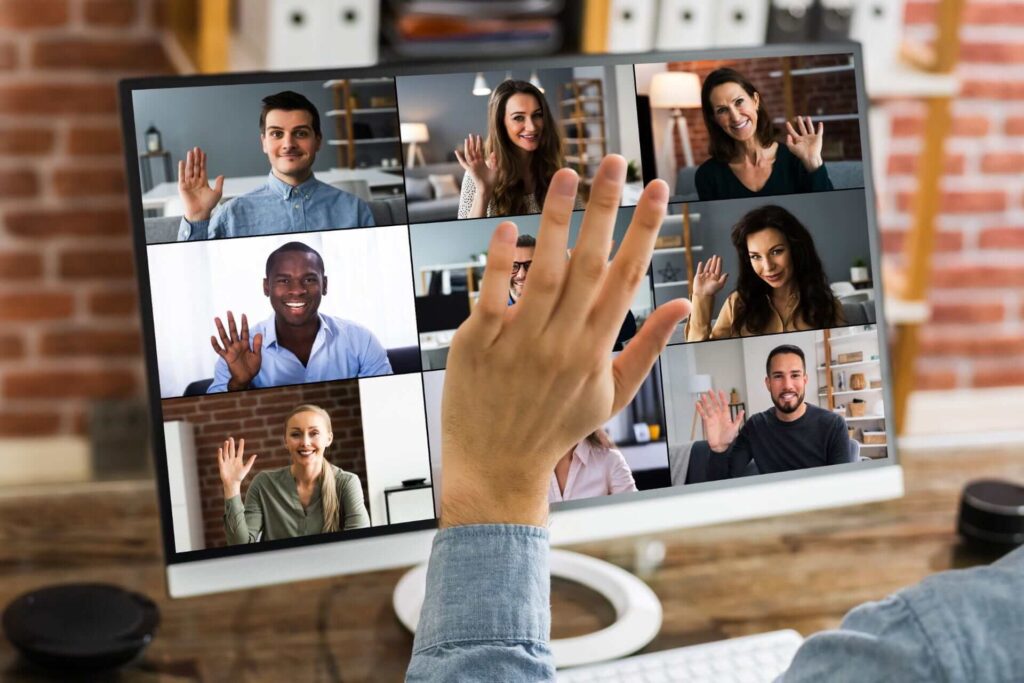 Hand waving Hello on Video Conference on desktop